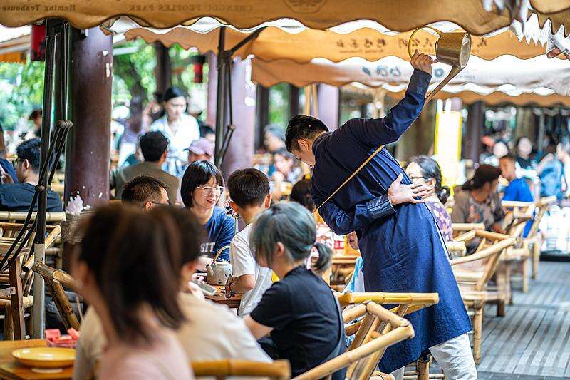 Find your seat in a century-old tea house. Order a cup of tea and watch the master pour hot water with fluid, dance-like motions using a long-spout co - 1
